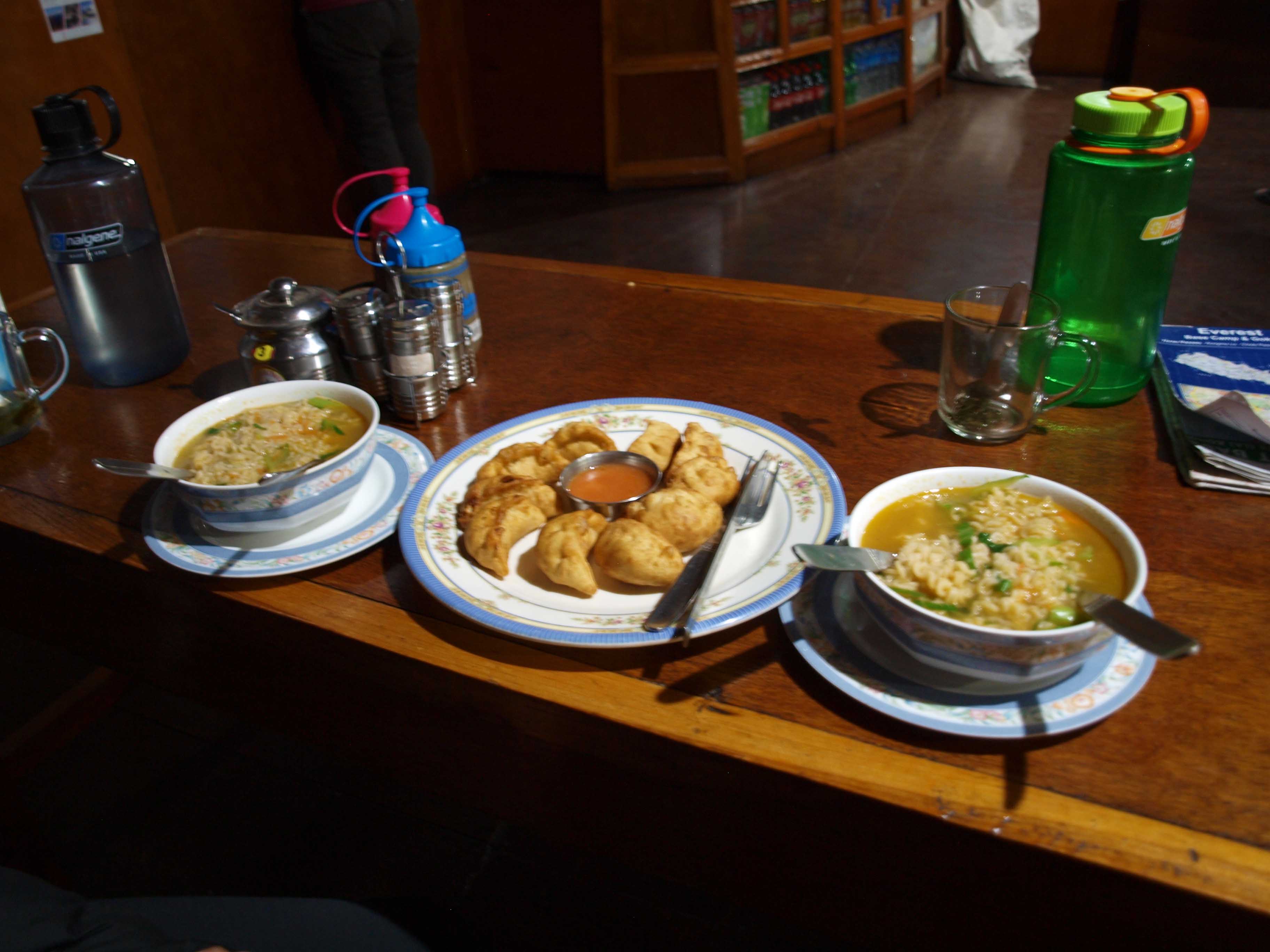 After a long hike rara noodle soup and fried momos in Machermo Everest Base Camp Trek
